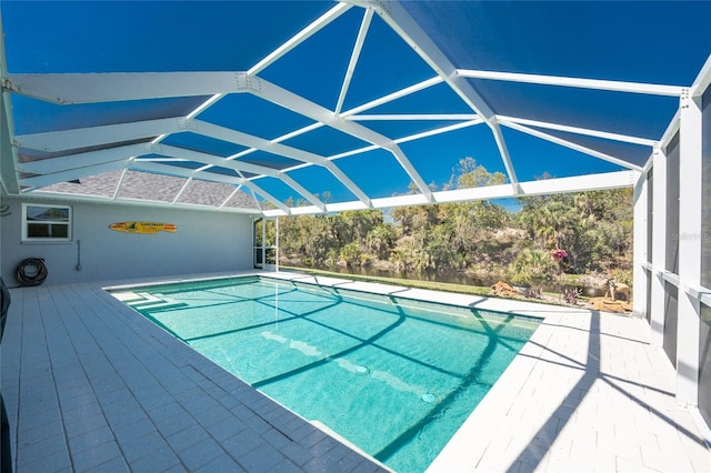 outdoor pool featuring glass enclosure