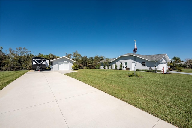 view of front of property with a front lawn, a garage, and driveway