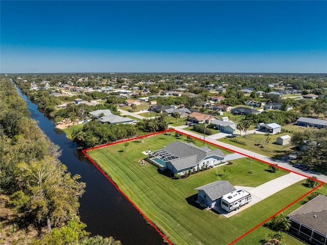 aerial view with a water view and a residential view