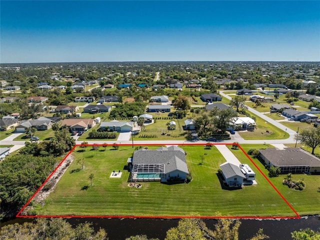 birds eye view of property with a residential view