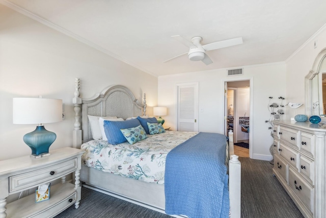 bedroom featuring baseboards, visible vents, a ceiling fan, dark wood-style flooring, and crown molding