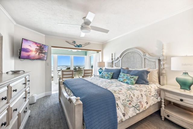 bedroom with ceiling fan, dark colored carpet, baseboards, and crown molding