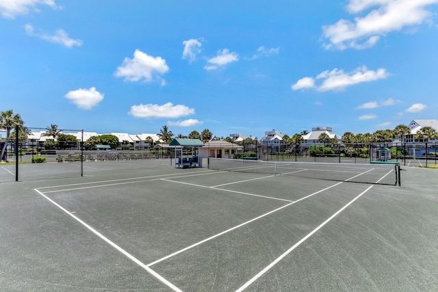 view of tennis court with fence