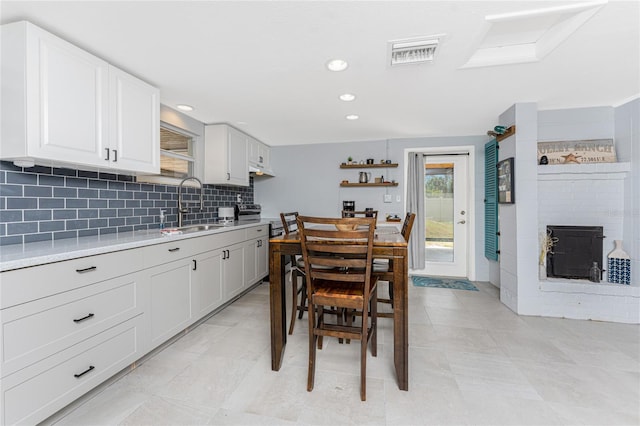 dining area with recessed lighting, visible vents, and a fireplace