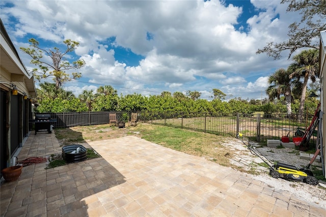 view of patio / terrace featuring a fenced backyard and a grill