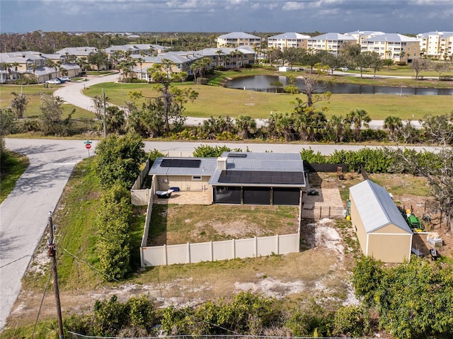 aerial view featuring a residential view and a water view