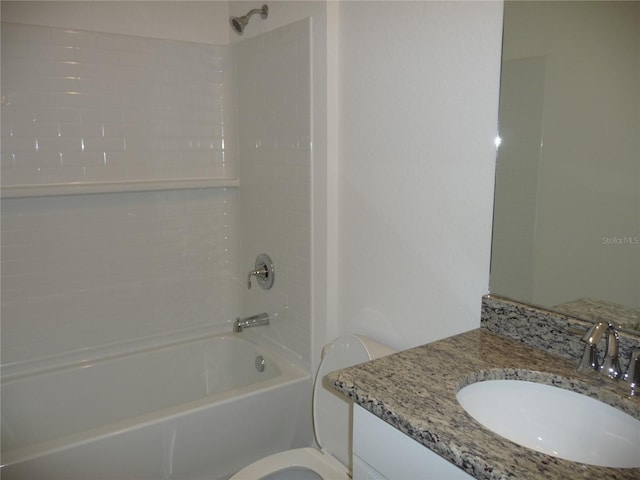 bathroom featuring shower / bath combination, toilet, and vanity