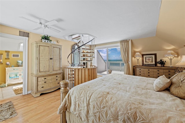 bedroom featuring access to exterior, visible vents, and light wood finished floors