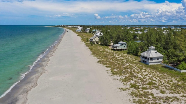 aerial view featuring a water view and a beach view