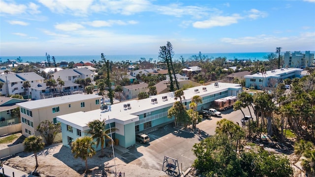 birds eye view of property with a residential view and a water view