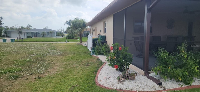 view of yard with a sunroom