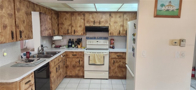 kitchen featuring light countertops, white appliances, brown cabinets, and under cabinet range hood