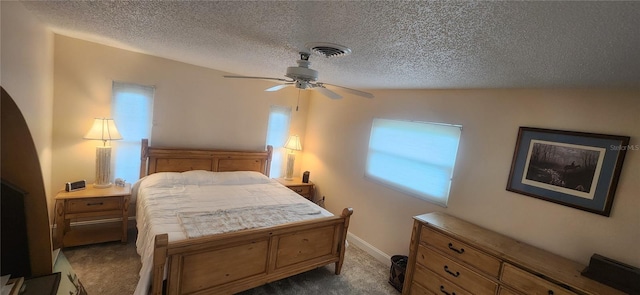 bedroom with carpet, visible vents, ceiling fan, a textured ceiling, and baseboards