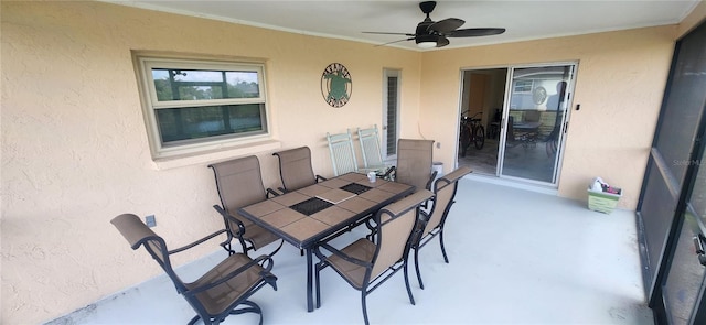 view of patio / terrace featuring ceiling fan and outdoor dining space