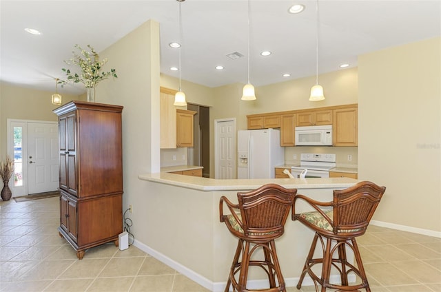 kitchen with visible vents, white appliances, a peninsula, light countertops, and baseboards