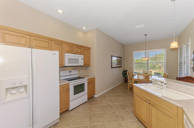 kitchen featuring light countertops, light tile patterned floors, hanging light fixtures, white appliances, and a sink