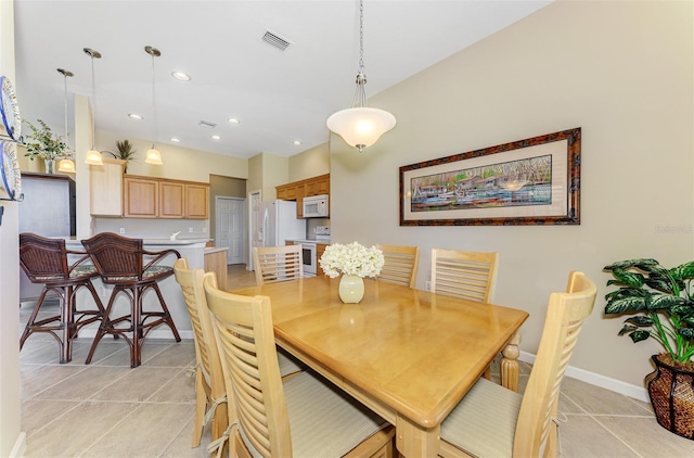 dining space featuring light tile patterned floors, visible vents, baseboards, and recessed lighting