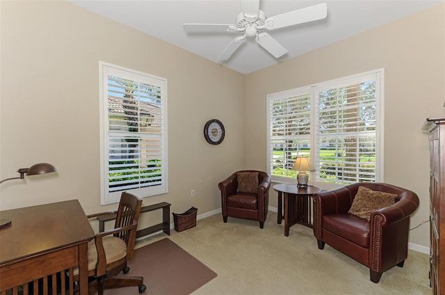 home office with light colored carpet, baseboards, and ceiling fan