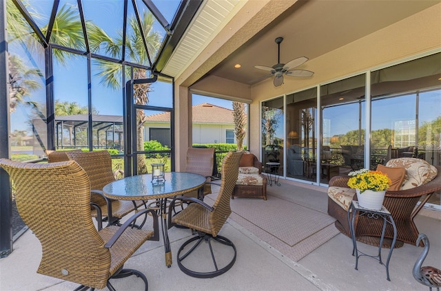 sunroom / solarium with plenty of natural light and a ceiling fan