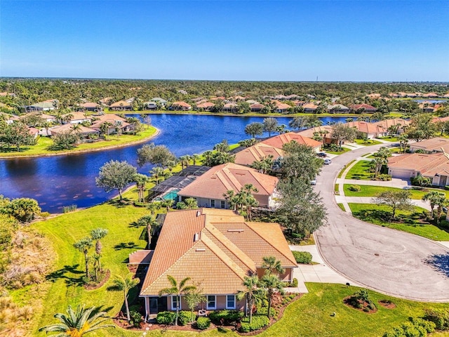 aerial view with a residential view and a water view