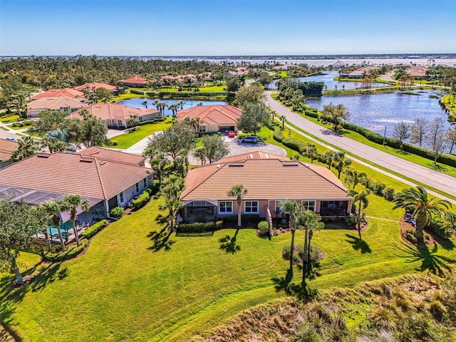 birds eye view of property featuring a residential view and a water view