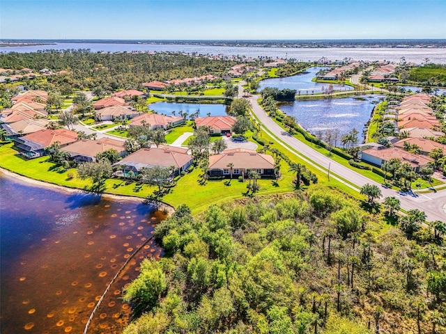 bird's eye view featuring a residential view and a water view