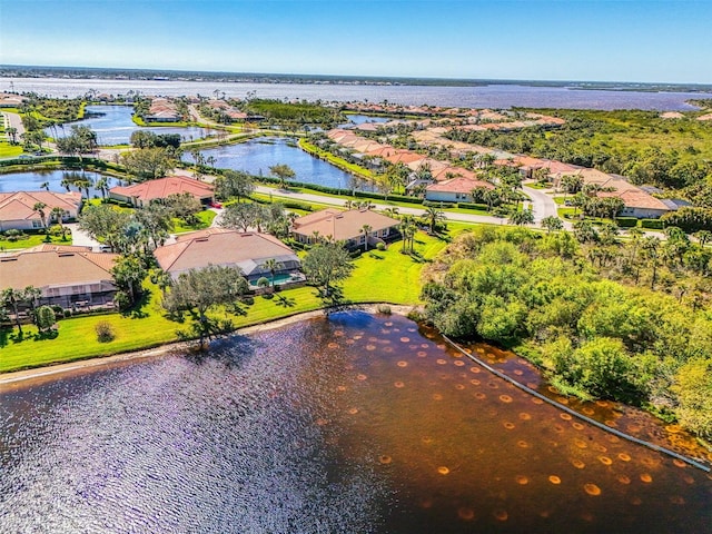 bird's eye view with a water view and a residential view