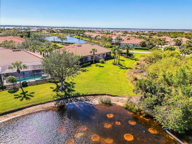 bird's eye view with a residential view and a water view