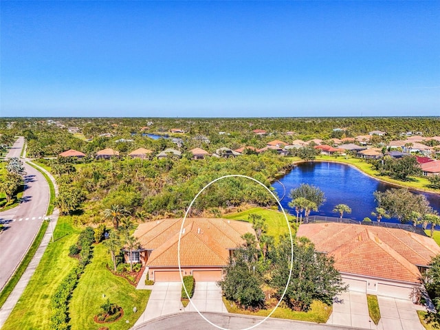 drone / aerial view with a water view