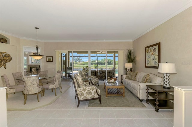 living area with light tile patterned floors, ornamental molding, and a fireplace