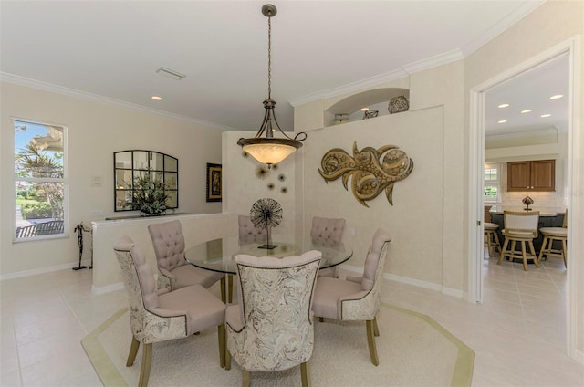 dining area with a healthy amount of sunlight and ornamental molding