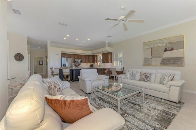 living room with crown molding, light tile patterned floors, recessed lighting, and visible vents