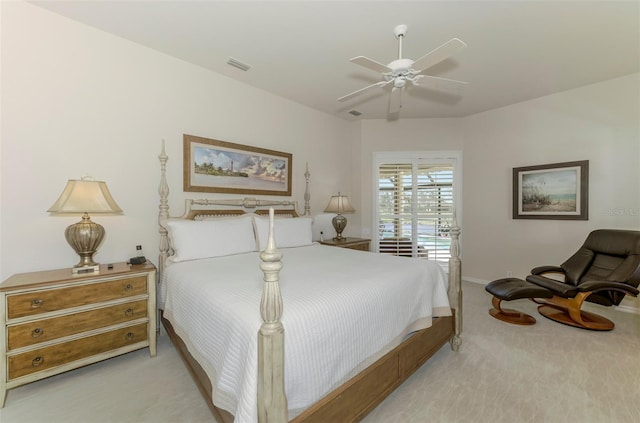 bedroom with carpet flooring, a ceiling fan, visible vents, and baseboards