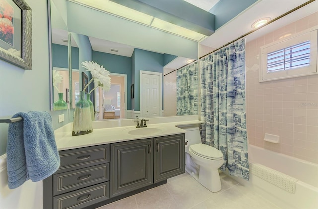 bathroom featuring tile patterned floors, toilet, vanity, and shower / bathtub combination with curtain