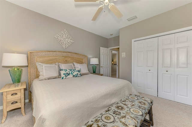 bedroom featuring a closet, visible vents, ceiling fan, and carpet floors