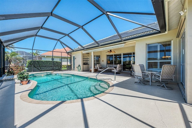 outdoor pool featuring a lanai, a ceiling fan, and a patio