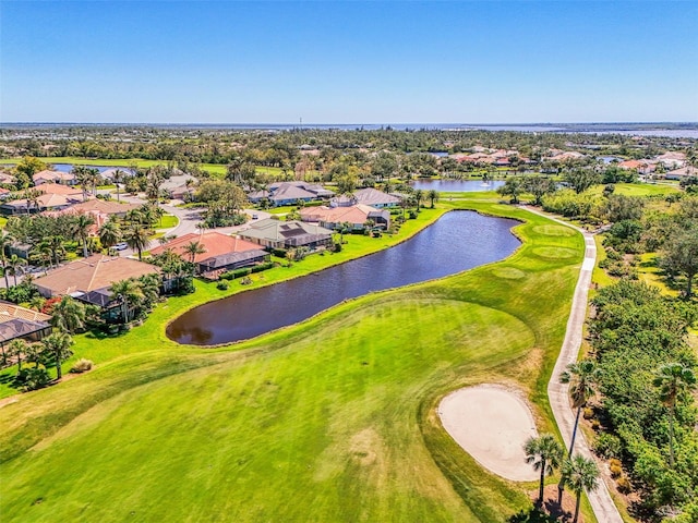 aerial view with view of golf course, a water view, and a residential view