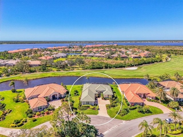 bird's eye view with a residential view and a water view