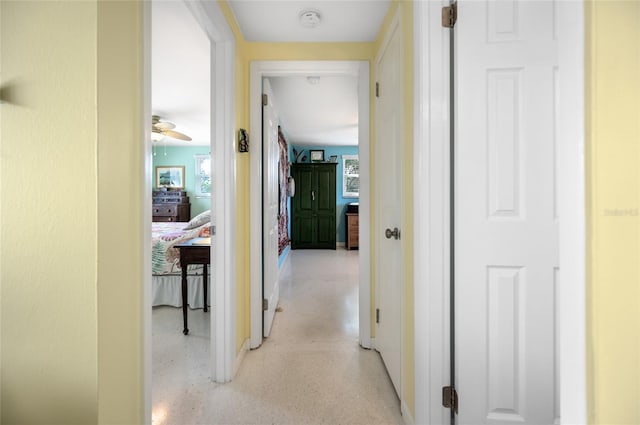 corridor with light speckled floor