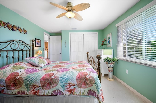 bedroom featuring visible vents, a closet, a ceiling fan, and baseboards