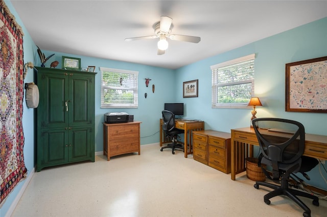 office space with a healthy amount of sunlight and ceiling fan