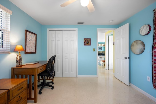 office featuring a ceiling fan, visible vents, and baseboards