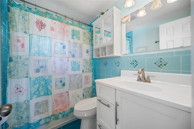 full bathroom with toilet, tasteful backsplash, tile walls, and vanity