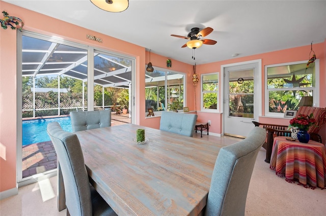 sunroom with ceiling fan