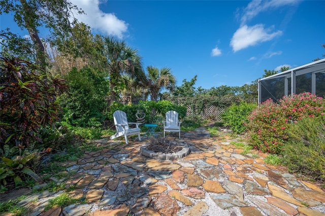 view of patio / terrace featuring a lanai