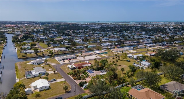 bird's eye view with a water view and a residential view