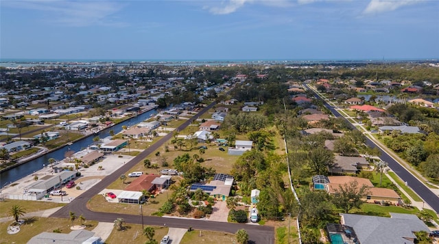 aerial view featuring a water view and a residential view