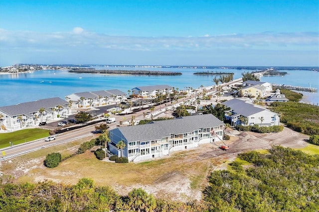 birds eye view of property featuring a water view and a residential view