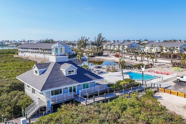 bird's eye view featuring a water view and a residential view