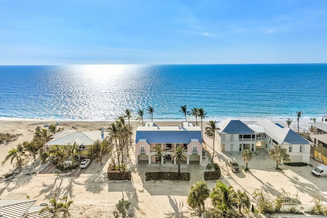 view of water feature with stairway, a residential view, and a beach view